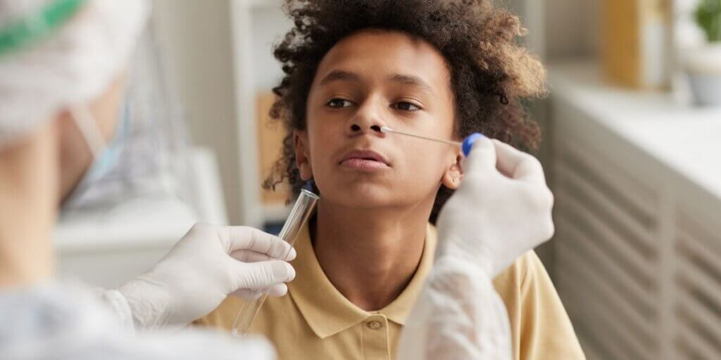 Child receiving covid test